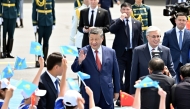 Chinese President Xi Jinping greets the welcoming crowd in Astana, Kazakhstan, June 16, 2025. (Xinhua/Yin Bogu)