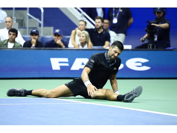 Serbia's Novak Djokovic reacts against Argentina's Mariano Navone during the men's singles first round tennis match on day one of the US Open tennis tournament at the USTA Billie Jean King National Tennis Center in New York City on August 30, 2026. (Photo by CHARLY TRIBALLEAU / AFP)