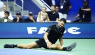Serbia's Novak Djokovic reacts against Argentina's Mariano Navone during the men's singles first round tennis match on day one of the US Open tennis tournament at the USTA Billie Jean King National Tennis Center in New York City on August 30, 2026. (Photo by CHARLY TRIBALLEAU / AFP)