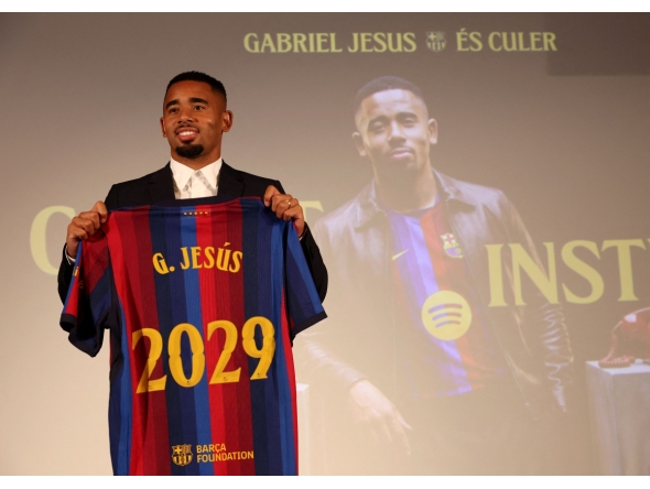 Brazilian forward Gabriel Jesus poses with his jersey during his official presentation as FC Barcelona's new football player on September 1, 2026 in Barcelona. (Photo by Lluis GENE / AFP)