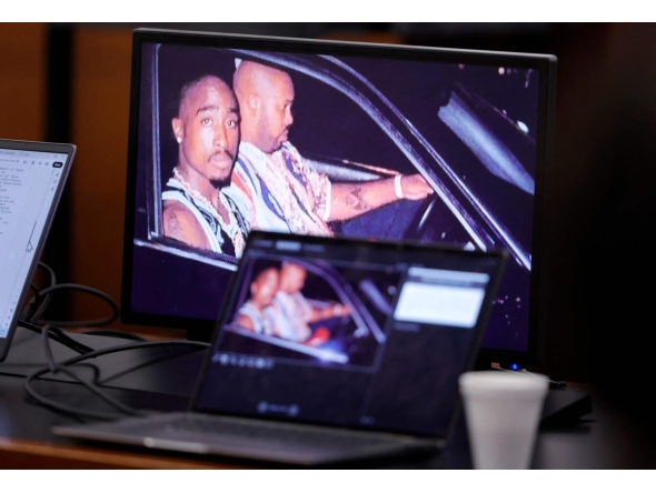 A 1996 photo of rapper Tupac Shakur (L) and Marion “Suge” Knight is shown on screens during closing arguments in the Duane Davis murder trial, related to the 1996 killing of rapper Tupac Shakur, at Clark County District Court at the Regional Justice Center in Las Vegas, Nevada, on August 31, 2026. (Photo by STEVE MARCUS / POOL / AFP)