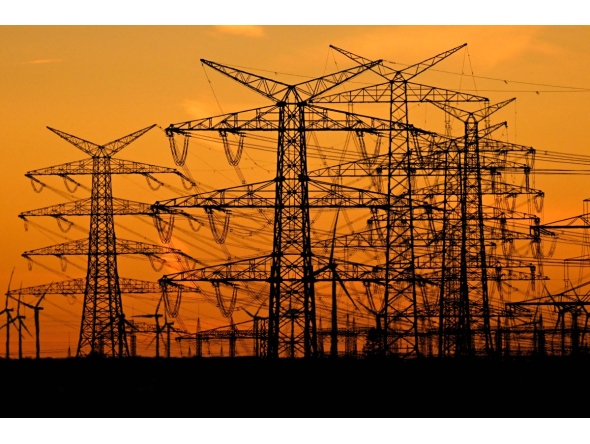 This picture taken on November 12, 2025 shows power poles near the lignite-fired power station operated by German energy giant RWE near Niederaussem, part of Bergheim, western Germany. Photo by Ina FASSBENDER / AFP