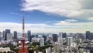 This picture taken from Azabudai Hills on August 28, 2026 shows the Tokyo Tower and the city skyline in Tokyo. (Photo by Philip FONG / AFP)
