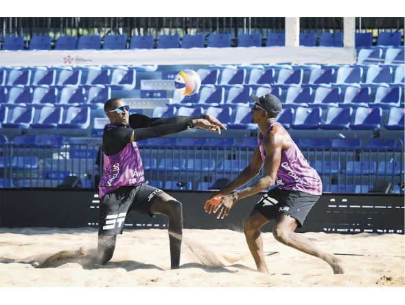Qatar’s Cherif Younousse (left) and Ahmed Tijan in action during their match yesterday. 
