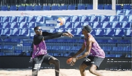 Qatar’s Cherif Younousse (left) and Ahmed Tijan in action during their match yesterday. 