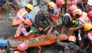 This handout photograph taken and released by the Nepal Army on September 4, 2026 shows army personnel carrying a worker who was trapped inside a tunnel, during a rescue operation at Trishuli-3A Hydropower Project in Nepal's Rasuwa district. Photo by Handout / NEPAL ARMY / AFP