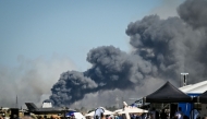 Smoke rises after a Phantom F-4 military jet crashed during the Athens Flying Week air show at the military airport of Tanagra, near Athens on September 5, 2026. (Photo by Theophile BLOUDANIS / AFP)
