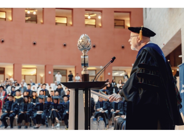 CMU-Q Dean Michael Trick addressing the students during the ceremony. 