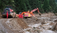 Excavators work to clear the road at Mingkeng Village, Suichuan County of east China's Jiangxi Province, Sept. 6, 2026. (Xinhua/Wan Xiang)