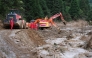 Excavators work to clear the road at Mingkeng Village, Suichuan County of east China's Jiangxi Province, Sept. 6, 2026. (Xinhua/Wan Xiang)