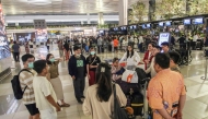 Stranded passengers gather as they wait at Soekarno-Hatta Airport in Tangerang on September 6, 2026. The Airport has been temporarily closed to all flight operations due to ash spewing from the Anak Krakatoa volcano. (Photo by Syarief Akbar / AFP) 
