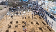An aerial view of residents and relatives of the victims killed in a bus crash gathering during their funeral at Sao Lourenco Church in the town of Sao Lourenco, on the island of Fogo, on September 6, 2026. (Photo by Herculano da Luz / AFP)