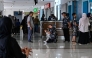 Passengers wait at a terminal of Iskandar Muda airport in Blang Bintang on September 6, 2026. Indonesia halted operations at its main international airport outside Jakarta on September 6, after ash spewed from the Anak Krakatoa volcano more than 150 kilometres away, impacting thousands of passengers. (Photo by CHAIDEER MAHYUDDIN / AFP)
