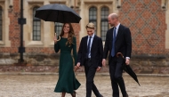 Britain's Catherine, Princess of Wales (L) and Britain's Prince William, Prince of Wales (R) walk with their 13-year-old son, Britain's Prince George of Wales (C), as he arrives for his first day at Eton College, in Eton, west of London, on September 8, 2026. (Photo by Adrian DENNIS / POOL / AFP)