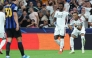 Real Madrid's French forward #10 Kylian Mbappe (R) celebrates scoring his team's first goal with teammate Real Madrid's Brazilian forward #07 Vinicius Junior during the UEFA Champions League first round day 1 football match between Real Madrid and Inter Milan at the Santiago Bernabeu stadium in Madrid on September 8, 2026. (Photo by Thomas COEX / AFP)