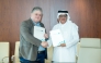 Director-General of the Qatar Press Centre Sadiq Mohammed Al Amari, and Head of the Gulf and Arabian Peninsula Studies Unit at the Arab Center for Research and Policy Studies, Dr. Haider Saeed during the singing ceremony.