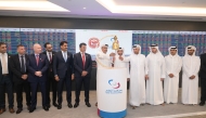 Senior officials of Baladna and Qatar Stock Exchange during the bell ringing ceremony at the QSE headquarters yesterday.