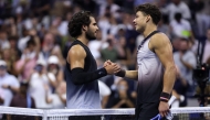 Carlos Alcaraz of Spain shakes hands after a loss against Ben Shelton of the United States during their Men's Singles Quarterfinal match on Day Ten of the 2026 US Open at USTA Billie Jean King National Tennis Center on September 08, 2026 in the Flushing neighborhood of the Queens borough of New York City. (Matthew Stockman/Getty Images/AFP)
