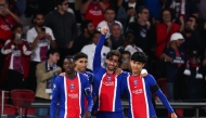 Paris Saint-Germain's Spanish forward #09 Ferran Torres (C) celebrates with Paris Saint-Germain's French forward #10 Ousmane Dembele (L), Paris Saint-Germain's Moroccan defender #02 Achraf Hakimi (2nd L) and Paris Saint-Germain's Spanish midfielder #27 Dro Fernandez (R) after scoring his team fourth goal during the UEFA Champions League, league phase, matchday 1, football match between Paris Saint-Germain (PSG) and Slovan Bratislava at the Parc des Princes Stadium in Paris on September 9, 2026. (Photo by FRANCK FIFE / AFP)