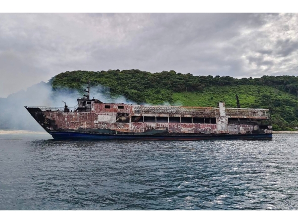 This handout photo taken and received from the Philippine Coast Guard (PCG) on September 10, 2026 shows the ruins of a ferry that caught fire off Palawan. (Photo by Handout / Philippine Coast Guard (PCG) / AFP) 