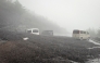 This handout photo taken on September 9, 2026 and received from Shizuoka prefecture on September 10, 2026 shows vehicles buried by mud and debris after a landslide swept into the parking lot at Fifth Station of Mount Fuji's Fujinomiya Trail in Fujinomiya, Shizuoka Prefecture. (Photo by Shizuoka Prefecture / AFP)