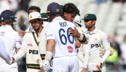 England's Joe Root (C) hugs Pakistan's Razaullah (2nd R) at the end of play on day four of the third Test match between England and Pakistan at Edgbaston cricket ground in Birmingham, central England, on September 12, 2026. (Photo by Darren Staples / AFP)