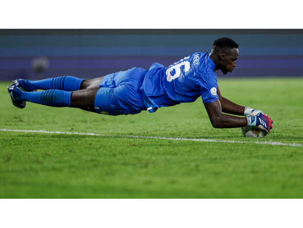Senegal's goalkeeper #16 Edouard Mendy grabs the ball during the Africa Cup of Nations (CAN) 2024 round of 16 football match between Senegal and Ivory Coast at the Stade Charles Konan Banny in Yamoussoukro on January 29, 2024.