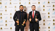 Ahmed Alkahlout and Fajir Abdul Majeed pose with the awards during the ceremony.