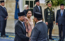 Indonesia's President Prabowo Subianto (R) shakes hands with newly appointed Finance Minister Suahasil Nazara (L) past his wife Christina Pusporini Messakh (C) during a swearing-in ceremony at the presidential palace in Jakarta on September 14, 2026, following a cabinet reshuffle. Indonesian president Prabowo Subianto removed Finance Minister Purbaya Yudhi Sadewa from his position, naming his deputy as the new minister. (Photo by FATIH MUBAROK / AFP)