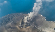 This handout aerial picture taken on September 6, 2026 and released on September 7, 2026 by the Indonesia's Center for Volcanology and Geological Hazard Mitigation shows the Mount Krakatau (Krakatoa) in the Sunda Strait, in South Lampung, Lampung province, spewing smoke and volcanic ash during an eruption. (Photo by Handout / Indonesia's Center for Volcanology and Geological Hazard Mitigation / AFP)