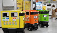 Mobile robotic trash bins are pictured during testing at the Shinjuku Station transport complex in Tokyo on September 18, 2026. Photo by Toshifumi KITAMURA / AFP
