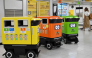 Mobile robotic trash bins are pictured during testing at the Shinjuku Station transport complex in Tokyo on September 18, 2026. Photo by Toshifumi KITAMURA / AFP
