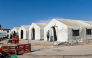 This picture shows large tents at the new Los Rosales migrant reception camp, where more than 800 people have been transferred from the Loma Colmenar camp, in Ceuta, on September 12, 2026. Photo by ANTONIO SEMPERE / AFP
