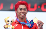 Japan's Takumi Hojo holds his gold medal on the podium of the men's individual triathlon during the 2026 Asian Games, on September 20, 2026. (Photo by JIJI Press / AFP) 