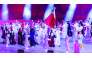 Mohammed Saadon Al Kuwari and Reem Al Sharshani carry the national flag as Qatari athletes march during the opening ceremony.


