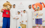 Officials with children during the event.