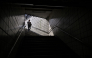 A person walks down the entrance of a metro station in Seoul on September 20, 2026. (Photo by Lillian SUWANRUMPHA / AFP)