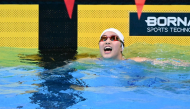 China's Yu Zidi celebrates after winning the final of the women's 200m individual medley swimming event during the 2026 Asian Games at the Tokyo Aquatics Centre in Tokyo on September 21, 2026. (Photo by Yuichi Yamazaki / AFP)