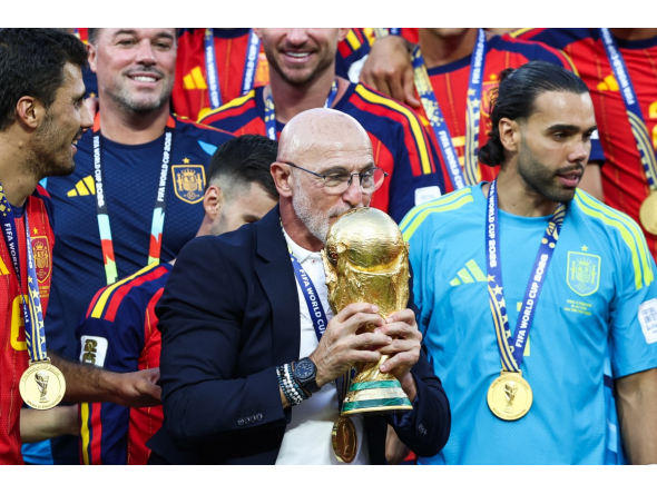 Spain's head coach Luis de la Fuente kisses the trophy after winning the 2026 World Cup football tournament final match between Spain and Argentina at the New York/New Jersey Stadium in East Rutherford on July 19, 2026. (Photo by Franck Fife / AFP)
