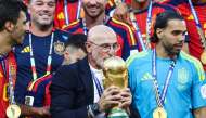 Spain's head coach Luis de la Fuente kisses the trophy after winning the 2026 World Cup football tournament final match between Spain and Argentina at the New York/New Jersey Stadium in East Rutherford on July 19, 2026. (Photo by Franck Fife / AFP)
