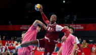 Action during the men's handball match between Qatar and China.