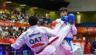 Qatar's Abdullah Rashad Mohi El Din Babiker in action against Palestine’s Abdullah Al Khatib.