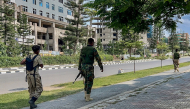 Members of the Tigray People's Liberation Front (TPLF) walk along a main road in Mekelle on September 23, 2026, as tensions intensify in northern Ethiopia after Tigrayan forces seized control of airports in the region. (Photo by AFP)