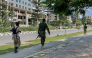 Members of the Tigray People's Liberation Front (TPLF) walk along a main road in Mekelle on September 23, 2026, as tensions intensify in northern Ethiopia after Tigrayan forces seized control of airports in the region. (Photo by AFP)