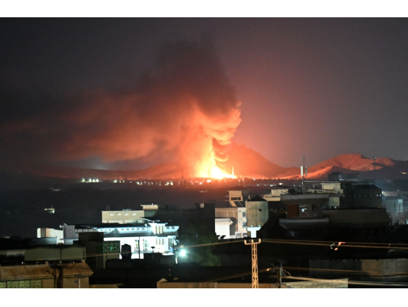 Flames and smoke rise from an area struck by an airstrike in Kandahar on September 24, 2026. (Photo by AFP)