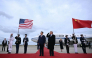 US President Donald Trump reacts after a B1 bomber flew past during the national anthems while he greeted Chinese President Xi Jinping upon his arrival at Joint Base Andrews in Maryland on September 23, 2026. (Photo by Brendan Smialowski / AFP)