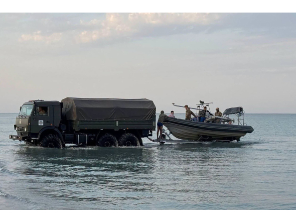 In this undated handout photograph released by the Kazakh Defence Ministry on September 25, 2026, Kazakh military personnel conduct search and rescue operations at an undisclosed location in the waters of the Caspian Sea. Photo by Handout / KAZAKH DEFENCE MINISTRY / AFP