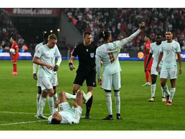 France's forward #10 Kylian Mbappe (C) reacts after scoring the opening goal and to a leg pain on September 25, 2026. (Photo by Ozan Kose / AFP)
