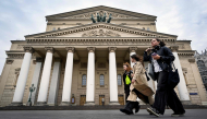 Women walk in front of the Bolshoi Theatre in Moscow on September 24, 2026. (Photo by Alexander Nemenov / AFP)