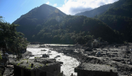 A general view shows damaged houses covered in sludge in the aftermath of the August 26 flash flood, at Betrawati Bazaar in Nepal's Rasuwa district on September 28, 2026. (Photo by Prakash Mathema / AFP)